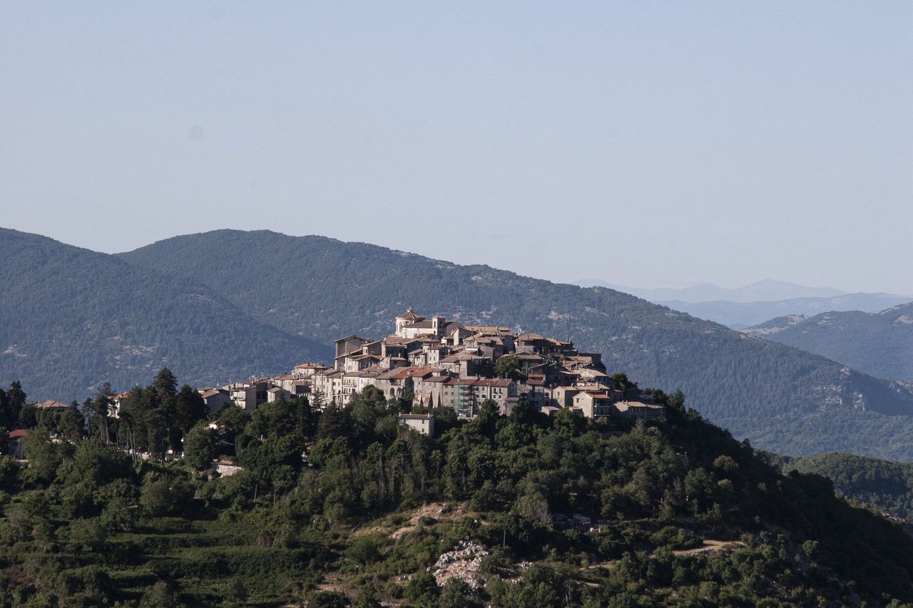 A hilltop town above wooded slopes in the Monti Prenestini